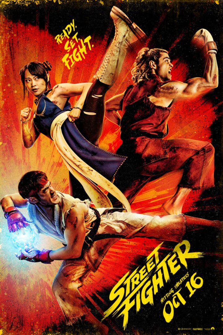Two fighters in a dramatic, high-energy pose from a Street Fighter poster, with a red–orange background and bold yellow title text reading 'Street Fighter II'.